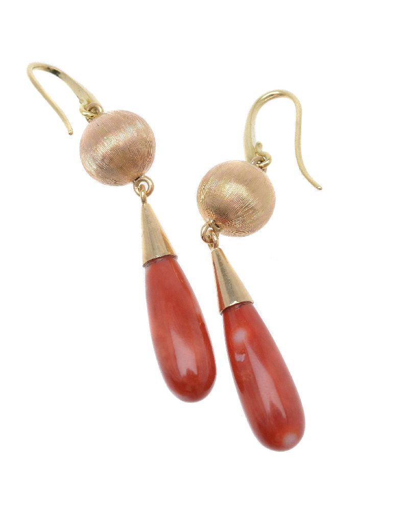 ϒ A pair of coral ear pendants, the polished coral drops suspended from a textured orb