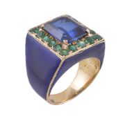 A synthetic sapphire and emerald dress ring, the step cut sapphire with canted corners claw set