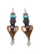 A pair of blackamoor ear pendants, the textured heads above gold coloured heart shaped panels,