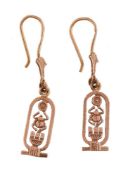 A pair of Egyptian gold coloured earrings, the cartouche shaped panels with a pierced design,