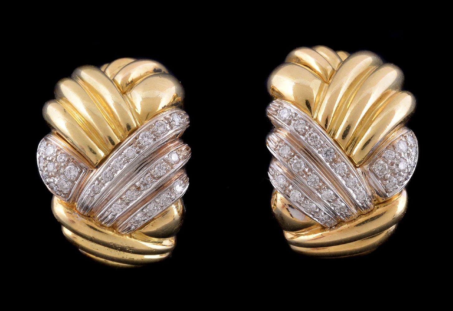 A pair of diamond earrings, the tapered reeded panels with diamond accents, approximately 0.54