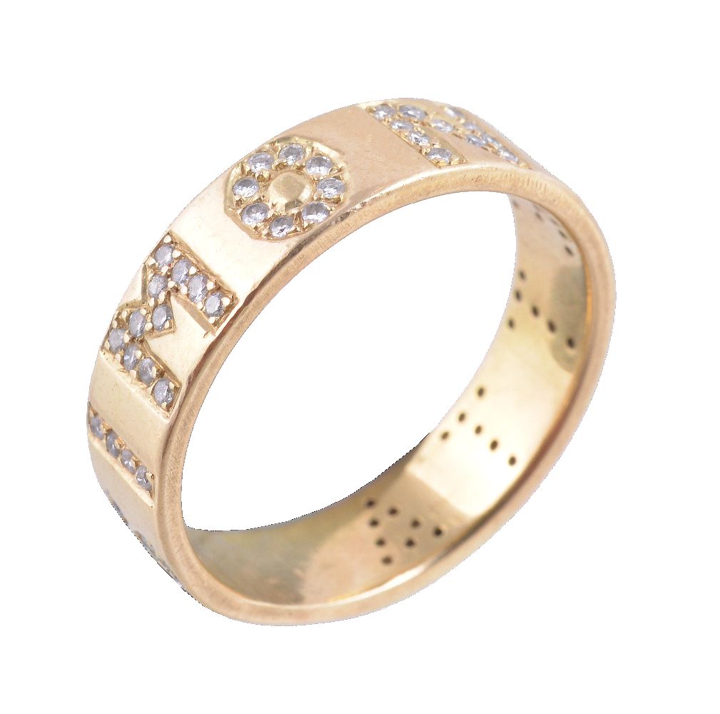 A diamond ring, the band set with brilliant cut diamonds, spelling out 'Simonetta', finger size O,
