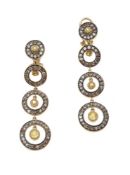 A pair of diamond and yellow sapphire earrings