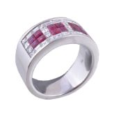 A ruby and diamond ring, set with panels of square cut rubies, approximately 1.20 carats total,