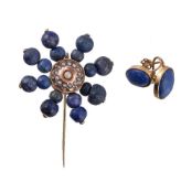 A lapis lazuli brooch, set with a cluster of lapis lazuli beads, centred around simulated pearls,