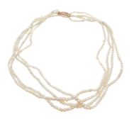 A four row natural pearl necklace, composed of graduating 2mm to 4.6mm natural pearls, to the clasp,