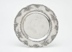 A German silver shaped circular plate by Georg Roth & Co., Hanau 1891- c. 1919