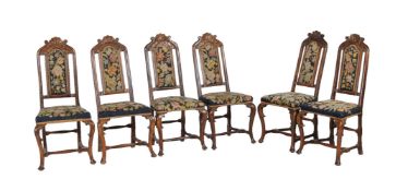 A set of six carved beech wood and upholstered dining chairs, early 18th century