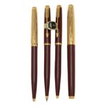 Parker, 75 Custom, a burgundy laque fountain pen, two ballpoint pens and a propelling pencil