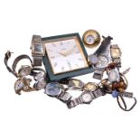 A collection of wristwatches and two clocks