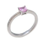 A pink sapphire and diamond ring