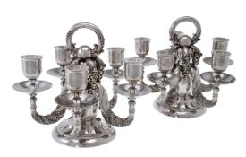 Georg Jensen, a pair of Danish silver Grape pattern candelabra