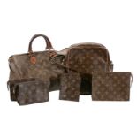 A collection of Louis Vuitton travel bags