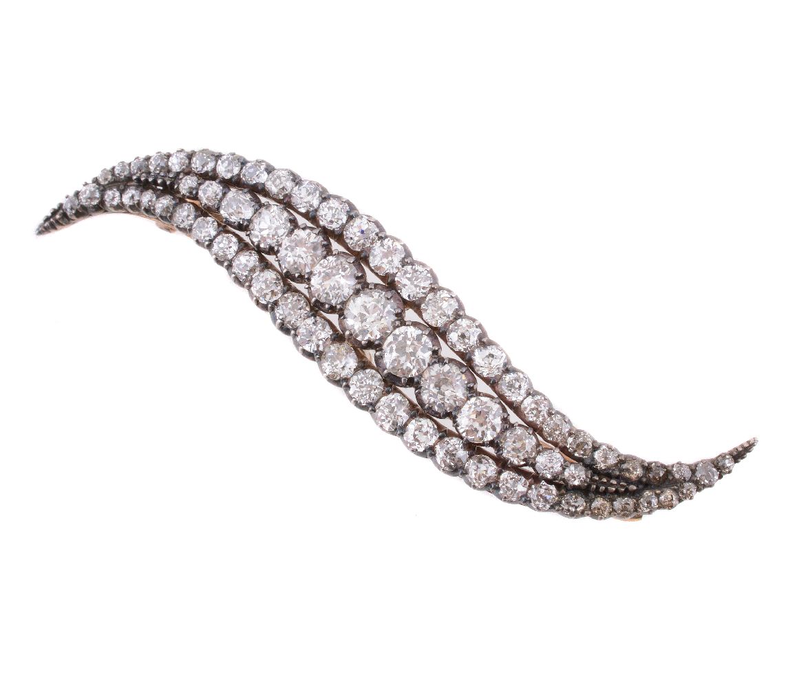 A Victorian curved diamond brooch