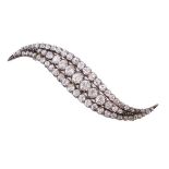 A Victorian curved diamond brooch