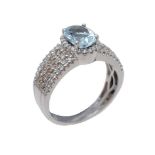 A blue topaz and diamond ring