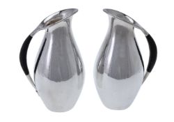 ϒ Georg Jensen, a pair of Danish silver water jugs or pitchers