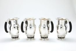 ϒ Georg Jensen, a Danish silver Grape pattern pitcher or jug