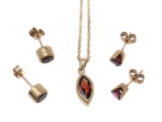 A pair of garnet ear studs and pendant