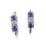 A pair of sapphire and diamond three stone earrings