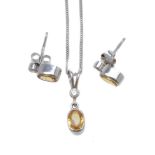 A diamond and yellow sapphire pendant and ear studs