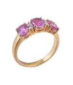 A pink sapphire and diamond ring