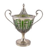 An Edwardian silver gilt sugar vase and cover