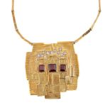 A 1970s 18 carat gold abstract pendant