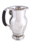 ϒ Georg Jensen, a Danish silver Grape pattern pitcher or jug