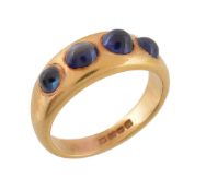 A cabochon sapphire four stone ring