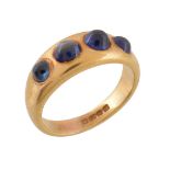 A cabochon sapphire four stone ring