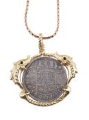 A Spanish coin pendant