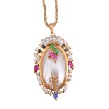 A synthetic gemstone and mabé pearl pendant