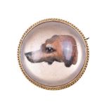 An early 20th century reverse painted crystal intaglio of a hound