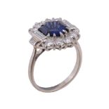 A sapphire and diamond panel ring