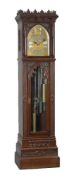 An impressive late Victorian Gothic revival carved mahogany quarter-chiming longcase regulator