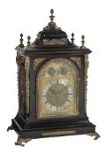 A large gilt brass mounted ebonised quarter chiming bracket clock