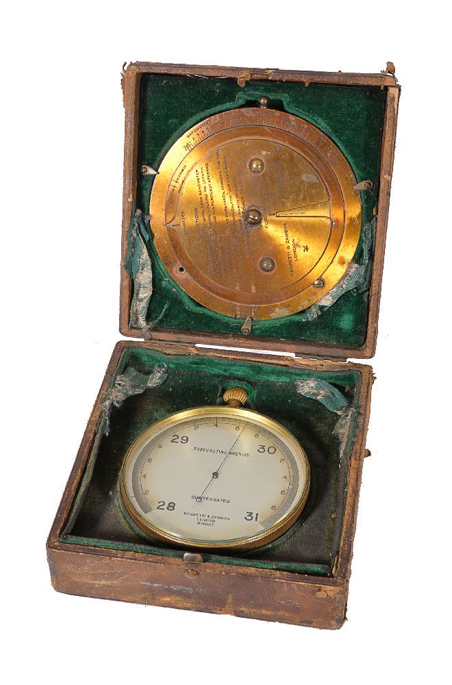 A gilt brass aneroid barometer and a brass weather forecasting calculator