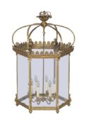 A substantial gilt metal and glazed six light hexagonal hall lantern