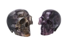 Two carved fluorspar (fluorite) models of human skulls