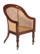 A George IV mahogany bergere library armchair