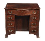 A mahogany kneehole desk in George III style