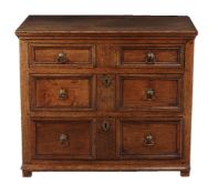 A Charles II oak chest of drawers