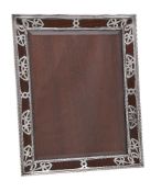 An Edwardian silver photograph frame by William Comyns & Sons