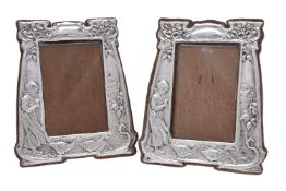 A matched pair of Arts and Crafts silver photograph frames by Charles S. Green