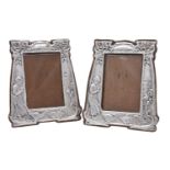 A matched pair of Arts and Crafts silver photograph frames by Charles S. Green