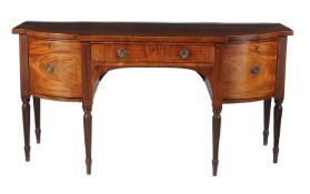 A George III mahogany and inlaid sideboard