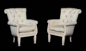 A pair of white painted and upholstered armchairs