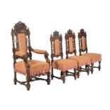 A set of eight oak Carolean revival dining chairs