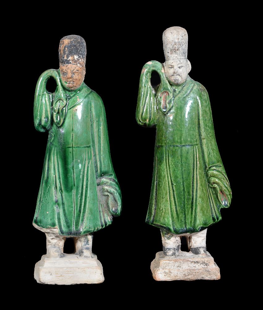 Two Chinese pottery figures of bearers